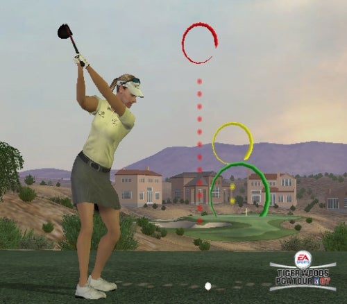 An in-game screenshot from Tiger Woods PGA Tour 07 showing a female golfer mid-swing on a virtual golf course with trajectory lines indicating the ball path.