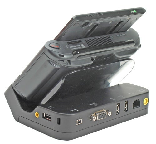 Sony Micro PC Vaio VGN-UX1XN docked in a black cradle showing various ports and expansion options, with the device screen partially visible and angled upwards.