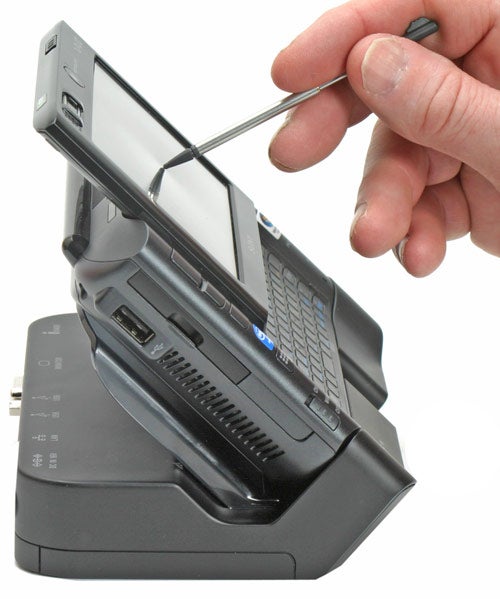 Sony Micro PC Vaio VGN-UX1XN in docking station with screen being lifted by a person's hand using a stylus.