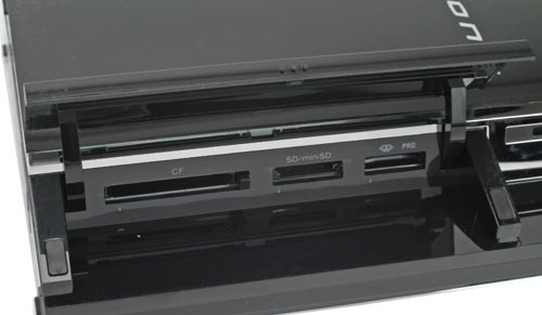 Close-up of a Sony PlayStation 3 console focusing on the media input slots for Compact Flash, SD/MMC, and Memory Stick PRO cards.