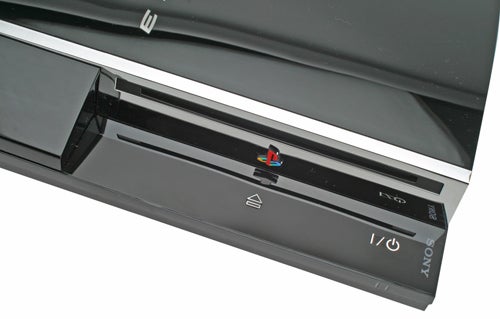Close-up of a Sony PlayStation 3 console with visible logo and power button.