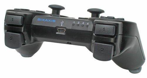 Black Sony PlayStation 3 Sixaxis wireless controller on a white background.