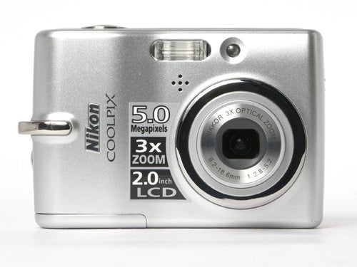 Nikon CoolPix L10 digital camera with 5.0 megapixels and 3x optical zoom lens on a white background.