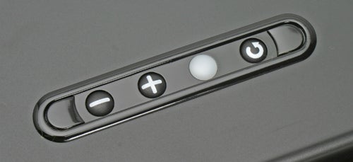 Close-up of the control buttons on a Parrot Boombox, featuring volume and power buttons.