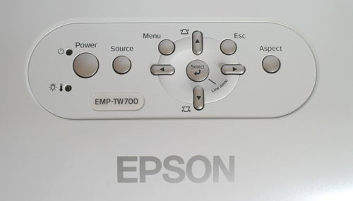 Close-up of the Epson EMP-TW700 projector's control panel with power, source, menu, escape, aspect, and navigation buttons.