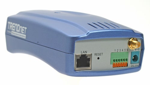 Side view of a TRENDnet TV-IP201W wireless IP camera, showing the LAN port, reset button, power indicator lights, and DC 5V power input.