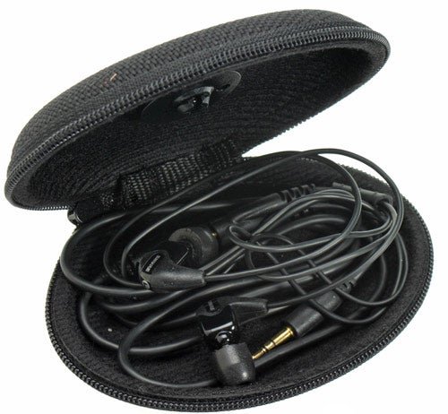 Shure SE210 Noise Isolating Earphones with black cable wound inside an oval-shaped, zippered black carrying case.