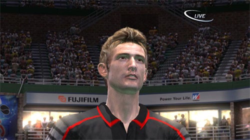 A screenshot from Virtua Tennis 3 showing a close-up of a male tennis player character with a stadium full of spectators in the background.