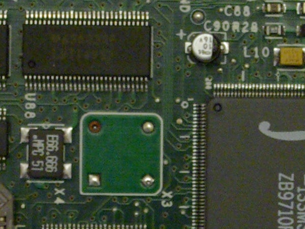 Close-up of a circuit board highlighting various electronic components and microchips, possibly from the interior of a Samsung GX-10 camera or related electronic device.