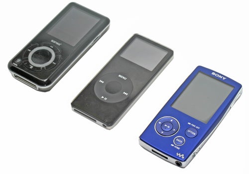 Three portable media players on a white background showing the Sony Walkman NW-A805 in blue on the right, a black competitor in the middle, and another black model on the left with a distinctive circular control interface.
