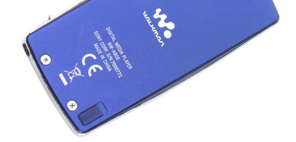 Blue Sony Walkman NW-A805 MP3 player lying on a white surface, showing the back panel with the Walkman logo and regulatory information.