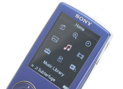 Sony Walkman NW-A805 MP3 player in blue with the screen displaying the Home menu including options such as Music Library and settings icons.