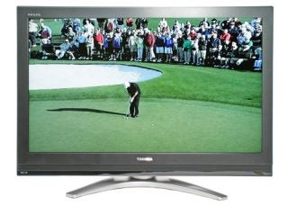 Toshiba Regza 42C3030D 42-inch LCD TV displaying a golf scene with vibrant colors and a crowd of spectators in the background, placed on a silver stand with the Toshiba logo visible on the lower bezel.