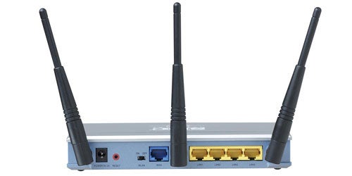 SMC Barricade N Broadband Router featuring two large antennas on each side, one smaller antenna in the center, multiple ports on the back, and status indicator lights on the front.