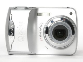 Pentax Optio E30 digital camera with 7.1 megapixels and 3x optical zoom lens, product shot on white background.