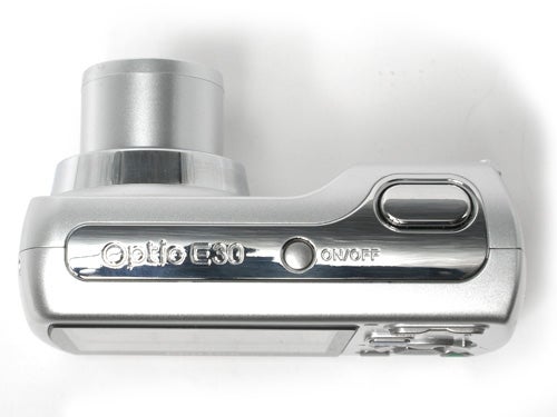 Pentax Optio E30 digital camera top view showing the power button, shutter release, and silver casing with model inscription.