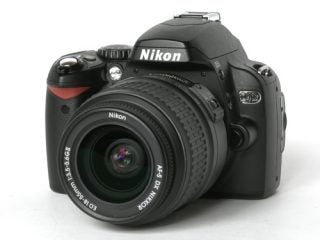 Nikon D40x DSLR camera with a standard lens, displayed against a white background.