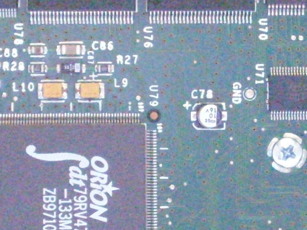 Close-up of a Samsung L700 camera circuit board showing electronic components and integrated circuits.
