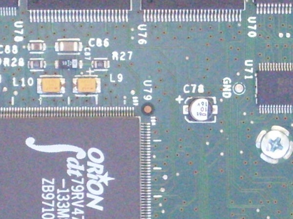 Close-up of an electronic circuit board with components and microchips, possibly from inside a Samsung L700 device or similar product.