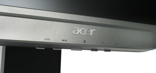Close-up of Acer AL2623W 26-inch widescreen LCD monitor showing the lower bezel with manufacturer's logo and on-screen display control buttons.