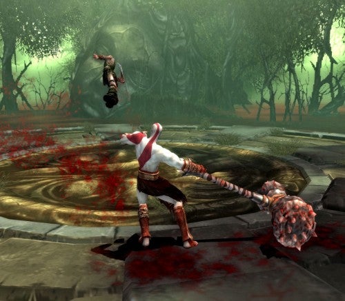 Kratos fighting enemy in God of War 2 gameplay scene.