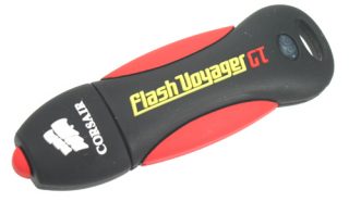 Corsair Flash Voyager GT 8GB USB flash drive with black and red rubber casing displaying the product's logo.