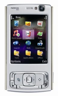 Nokia N95 smartphone in silver with a display showing colorful menu icons for contacts, messaging, calendar, and other applications, featuring a front-facing camera and navigational buttons.