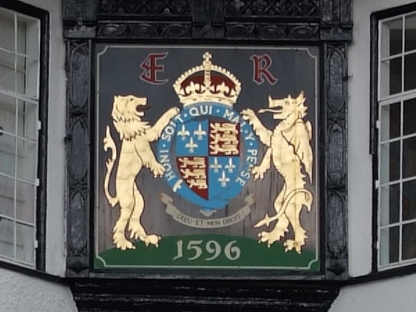 Coat of arms emblem on building facade captured in high detail