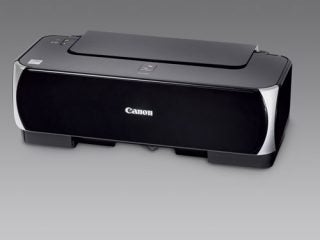 Canon PIXMA iP2500 inkjet printer with sleek black design on a neutral background.