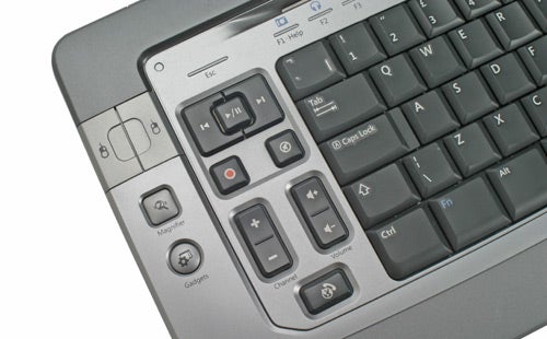 Close-up view of the Microsoft Wireless Entertainment Desktop 7000 keyboard showing media control keys, Windows start button, and zoom slider.