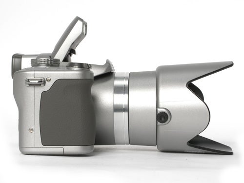 Side view of a Panasonic Lumix DMC-FZ8 digital camera with the lens hood attached and extended, displayed against a white background.