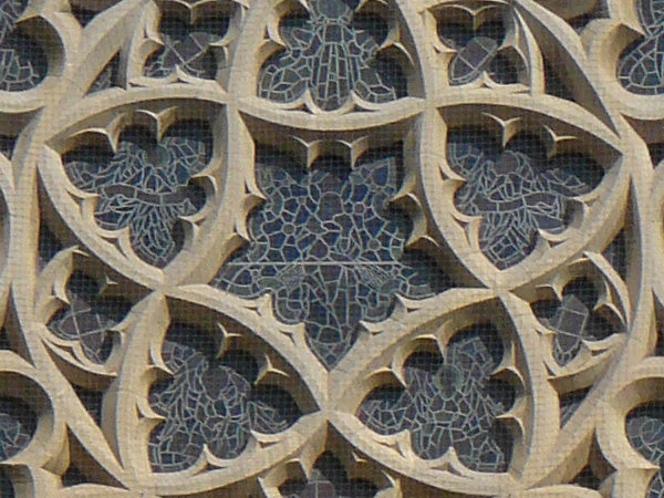 The image displays a detailed close-up of an intricate stone lattice work with an arabesque pattern, demonstrating the high-resolution and clarity capabilities of the Panasonic Lumix DMC-FZ8 camera.