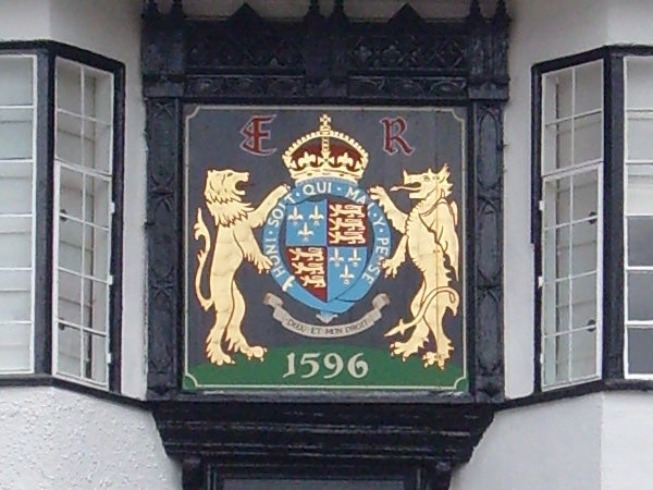 Historic coat of arms on building facade from 1596.