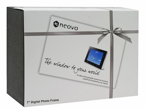 Packaging box of AG Neovo FotoVivo V10 7-inch Digital Photo Frame with decorative ribbon and product image, featuring the slogan 
