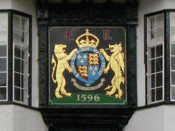 Coat of arms plaque on building with date 1596.