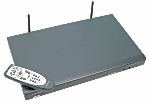 Netgear Digital Entertainer HD EVA8000 media streaming device with accompanying remote control, featuring dual Wi-Fi antennas and front panel display.