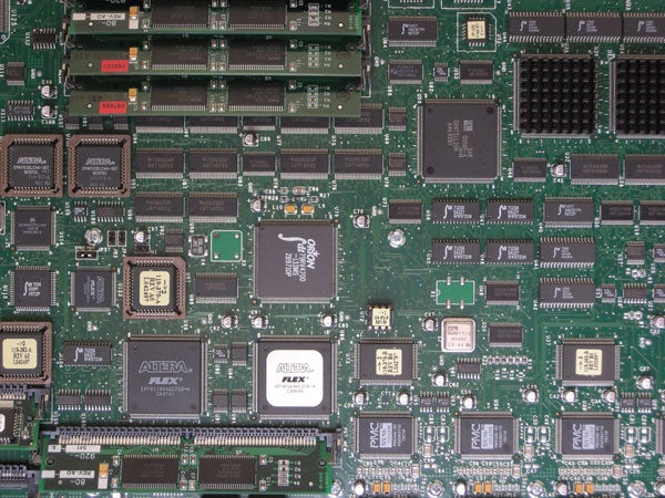 Close-up photo of various integrated circuits on a motherboard.