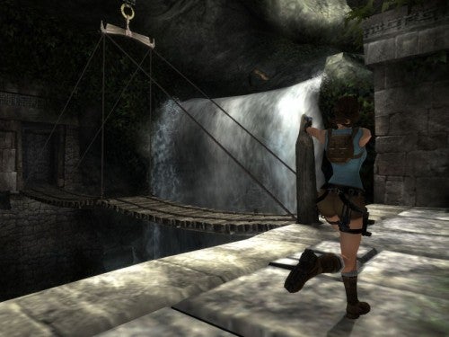 Lara Croft character approaching a waterfall in Tomb Raider: Anniversary.