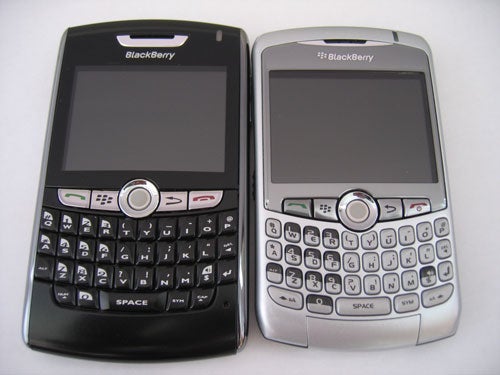 Two BlackBerry Curve 8300 smartphones, one black and one silver.