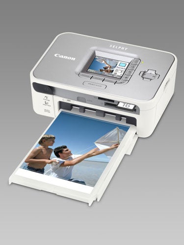 Canon Selphy CP750 printer with printed photo coming out.