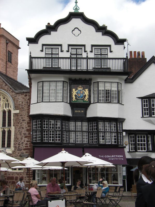 Historic building with patrons dining outside