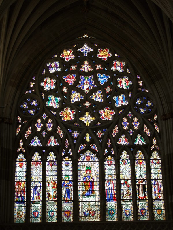Stained glass window with intricate designs and vibrant colors