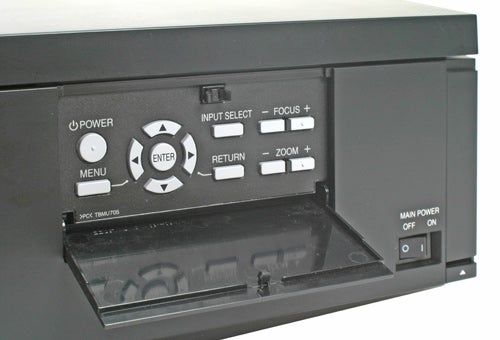Close-up of Panasonic PT-AE1000E projector's control panel.