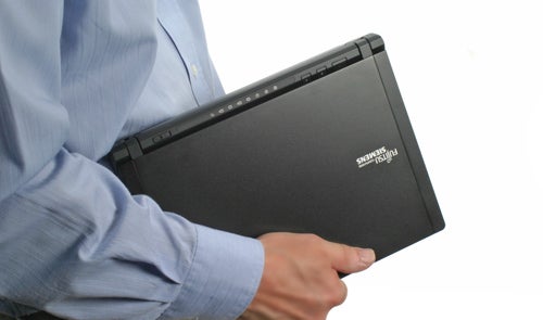 Person holding a Fujitsu Siemens Lifebook P7230 laptop.