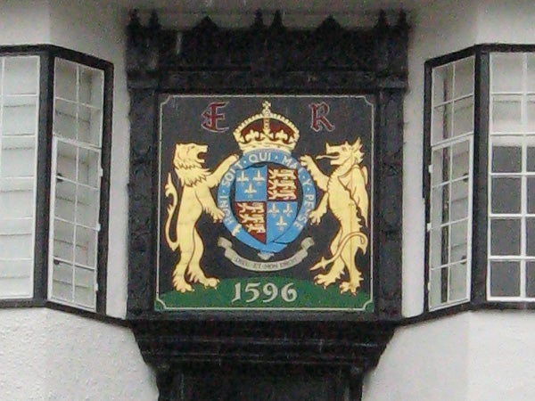 Coat of arms on a building facade with date 1596.