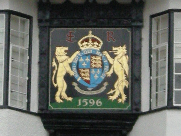 Coat of arms plaque on a building facade from 1596.