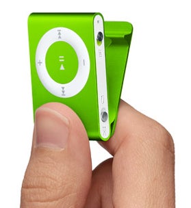 Hand holding green Apple iPod Shuffle.