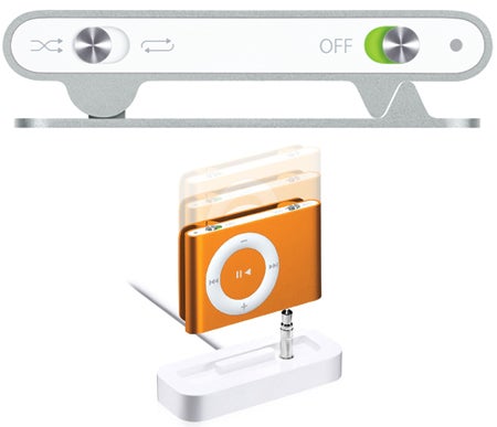 Apple iPod Shuffle 1GB in orange with dock and headphones.