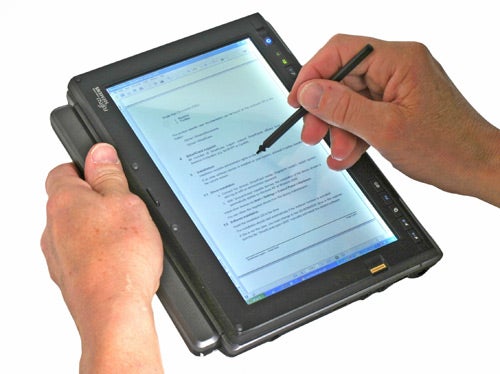 Hands using stylus on Fujitsu-Siemens Lifebook P1610 Tablet PC.
