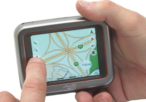 Hands holding Mio DigiWalker C220 GPS with map display